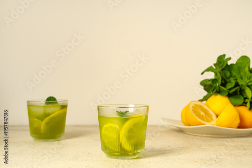 Glasses of tasty lemonade w...