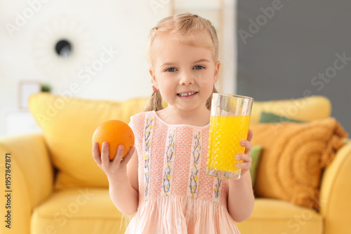 Cute little girl with glass...