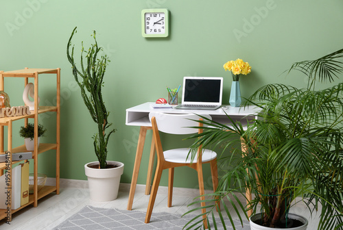 Workplace with bouquet of n...