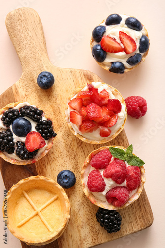 Wooden board of tasty tartl...