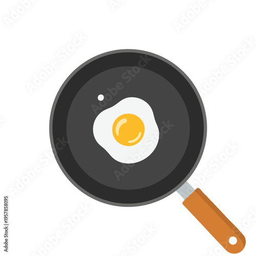 Overhead view of a fried egg in a dark pan with a wooden handle