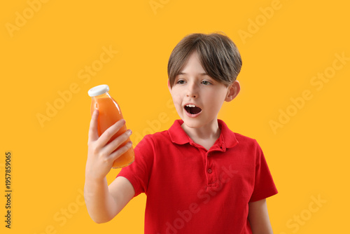Surprised little boy with b...