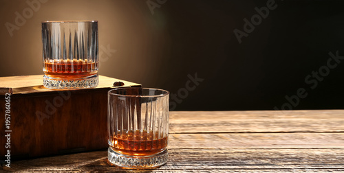 Glasses of whiskey and box ...