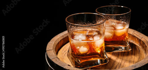 Glasses of cold whiskey on ...
