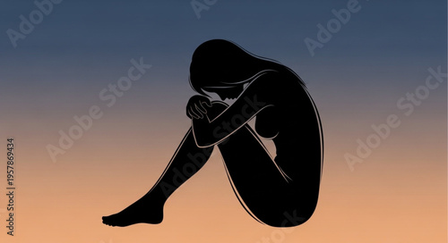 Silhouette of a Woman Embracing Knees in Despair.