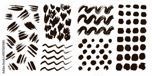 Collection of abstract black brushstrokes and paint splatters on white