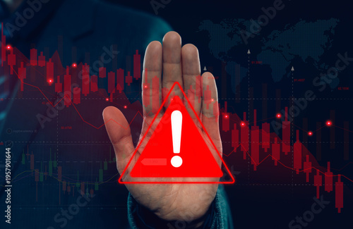 Foto Businessman showing stop hand gesture with warning alert symbol over falling stock market chart representing financial risk market crash, economic crisis investment loss and global trading volatility