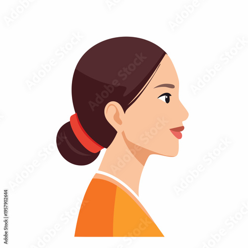 Young woman's profile with hair bun and orange top