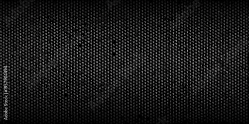 Dark textured background resembling woven fabric or a speckled surface