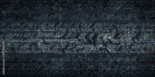 Dark textured background of repeating tire tread patterns
