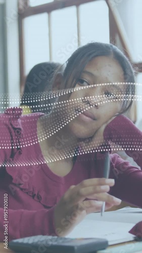 Vertical video: School teen starting work writing and pausing while dotted wave sweeping over face