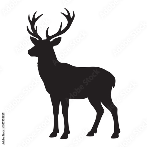 Black silhouette of a deer with antlers standing tall