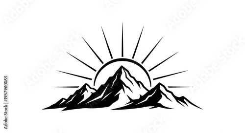 Mountain peaks with sunburst rising behind them.