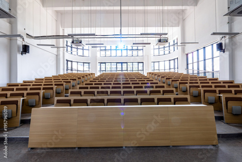 Εκτύπωση καμβά Modern university lecture hall with empty tiered seating and wooden podium under