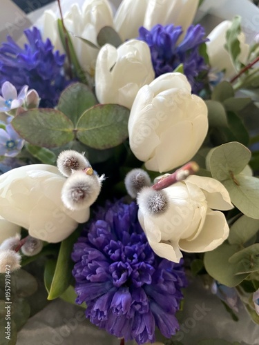 Spring Easter bouquet with pussy willow branches, white tulips and blue hyacinths