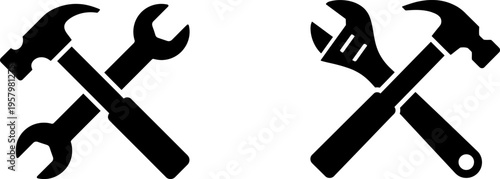 A set of two black silhouettes showing crossed construction tools for repair and maintenance work