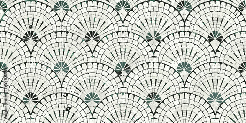 Intricate mosaic pattern featuring repeating fan shaped designs in neutral tones