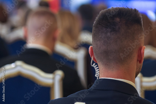Protection and Guard Service (SPP, Romanian version of the US Secret Service) officer in public during the speech of a dignitary