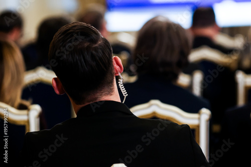 Protection and Guard Service (SPP, Romanian version of the US Secret Service) officer in public during the speech of a dignitary