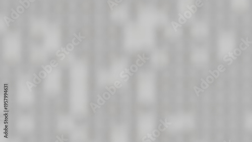 A heavily blurred abstract background, showing subtle, indistinct dark spots and forms on a medium dark grey field