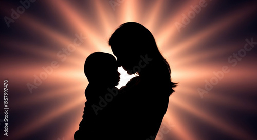 Silhouette of a mother and child embracing warmly against a vibrant sunburst background