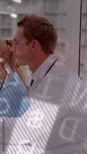 Vertical video: MD leaning offering swab to nurse for oral test, overlay partially obscuring scene