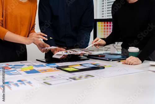 UX developer and ui designer brainstorming about mobile app interface wireframe design with customer breif and color code, User experience concept.