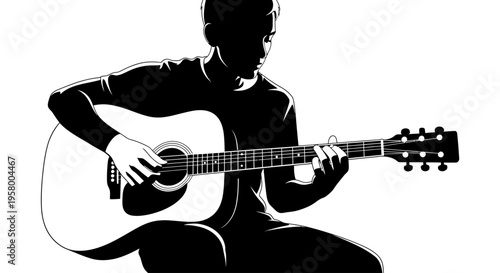 Silhouette of a male musician playing an acoustic guitar with skill.