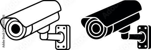 Two security cameras mounted on a wall in contrasting styles for surveillance.