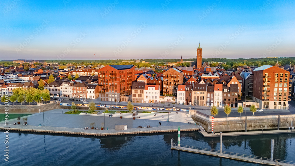Obraz premium Venlo town cityscape, marina and waterfront near Meuse river aerial drone view, Venlo bird’s view on sunny weather, Limburg, the Netherlands