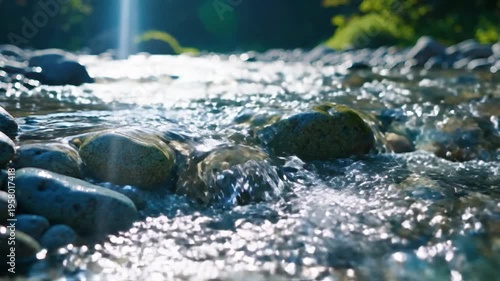 Crystal-clear water cascades over smooth river stones, illuminated by bright sunlight in a serene natural setting