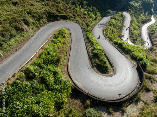 Картината върху платно Motorcyclists navigate the winding mountain roads of Doc Tham Ma Pass, Dong Van, Ha Giang, Vietnam