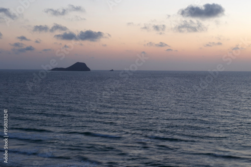 Seascape with rock at sunrise