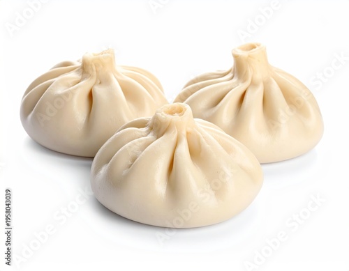 Three uncooked Georgian khinkali dumplings on a white background.