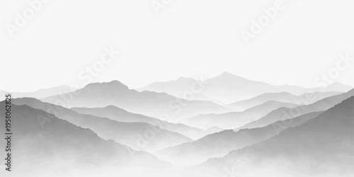A misty mountain landscape captures a serene morning view of snowy peaks and forest valleys shrouded in fog under a soft sunrise sky