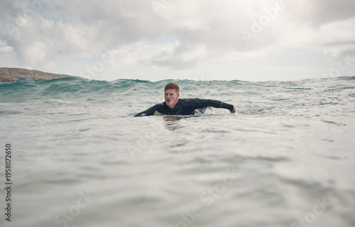 Photography Swimming, surfer and man in ocean water for fitness, exercise and practice with waves on holiday