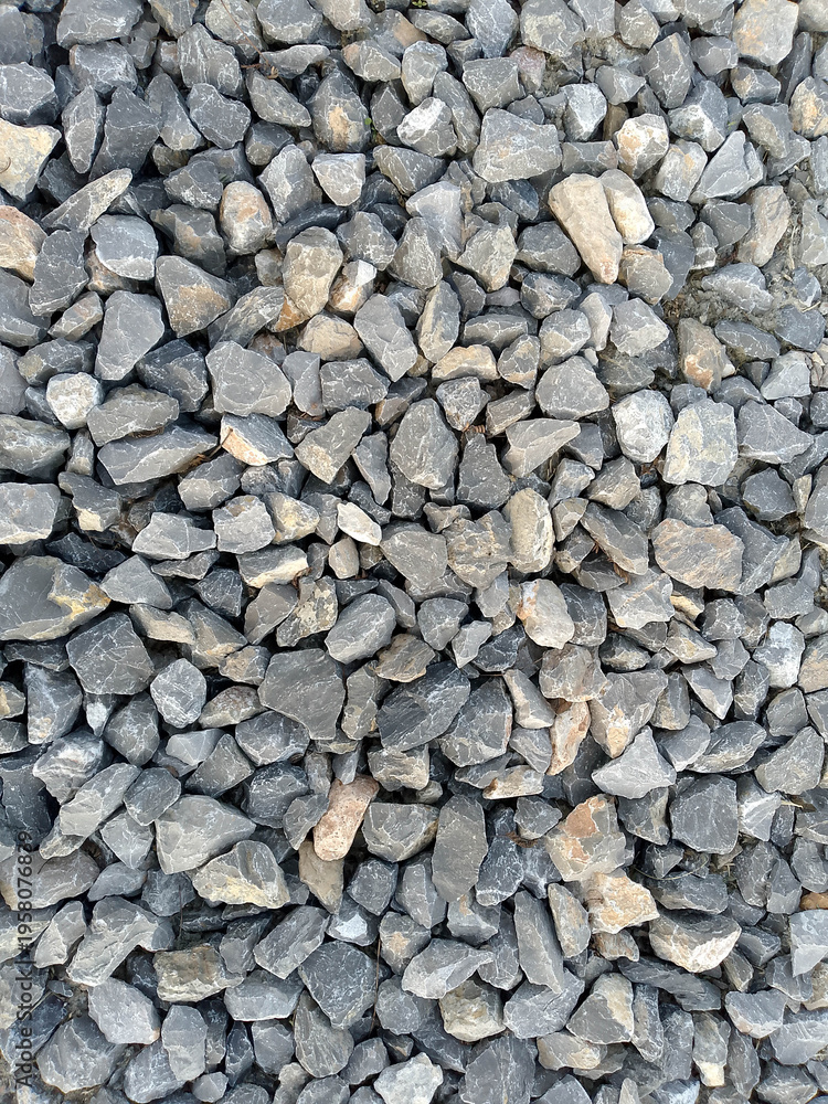 Naklejka premium Small Gray and Beige Gravel Stones Close-up Texture