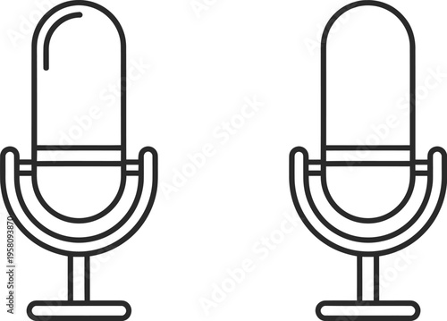 Two microphones are standing side by side on a white background in a studio setting.