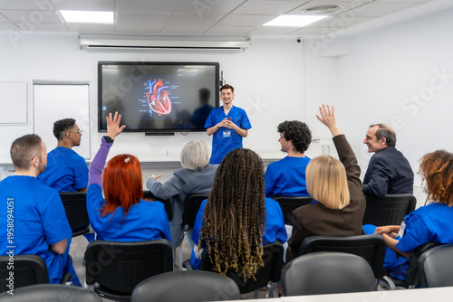 Obraz na płótnie Medical students learning heart anatomy during a healthcare seminar