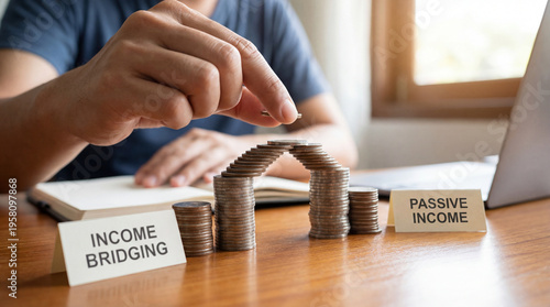 Money Income money concept with hand stacking coin bridge between income bridging and passive income on wooden table