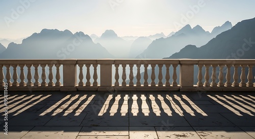 Balcony view of misty mountains at sunrise with dramatic shadows on the terrace, serene landscape panorama