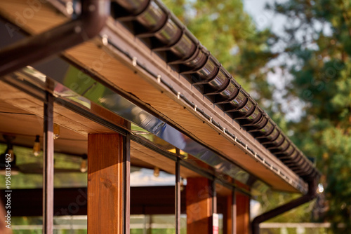 Part of the building cornice and drainage system of the building. semicircular gutter with a drainpipe.