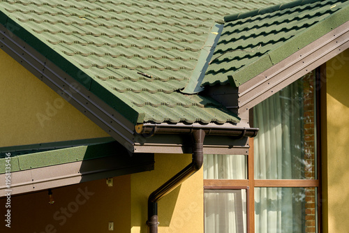 Part of the building cornice and drainage system of the building. semicircular gutter with a drainpipe.