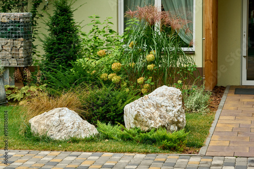 Entrance to the building with gabions and garden stones