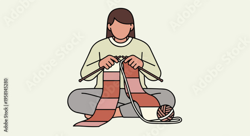 Person sitting cross-legged, knitting a multi-colored scarf with yarn ball