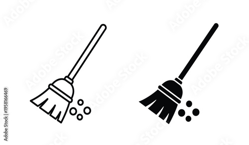 Silhouette of two brooms sweeping up debris in a simple black and white illustration