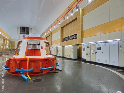 The industrial interior of Ialy Hydroelectric Power Plant featuring massive generators and turbine hall in Gia Lai, Vietnam.