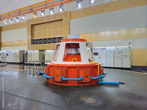 The industrial interior of Ialy Hydroelectric Power Plant featuring massive generators and turbine hall in Gia Lai, Vietnam.