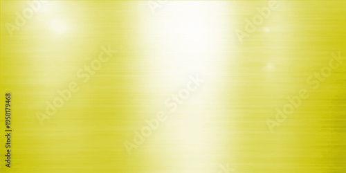 Abstract close-up shot of a bright, polished yellow metallic texture background that appears gleaming with soft, diffused highlights.