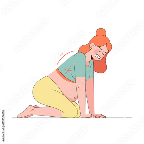 Pregnant woman experiencing labor pain while kneeling on the floor  